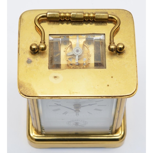 259 - Matthew Norman, London, a brass alarm carriage clock, the white enamel dial with Roman numerals and ... 