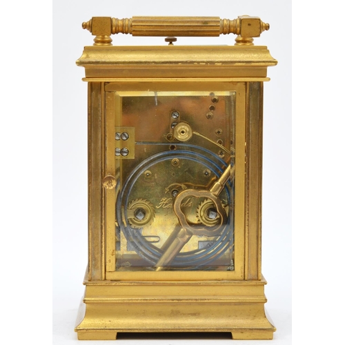 263 - A brass repeating and striking carriage clock, the white enamel dial with Roman numerals, the unsign... 