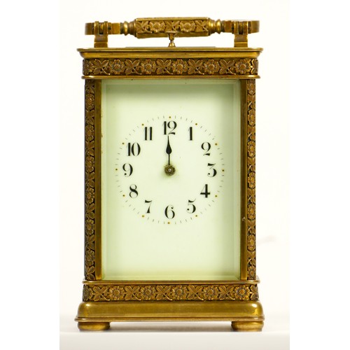 265 - A brass repeating and striking carriage clock, the dial with Arabic numerals, the case with applied ... 