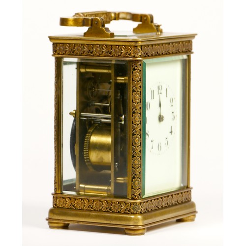 265 - A brass repeating and striking carriage clock, the dial with Arabic numerals, the case with applied ... 