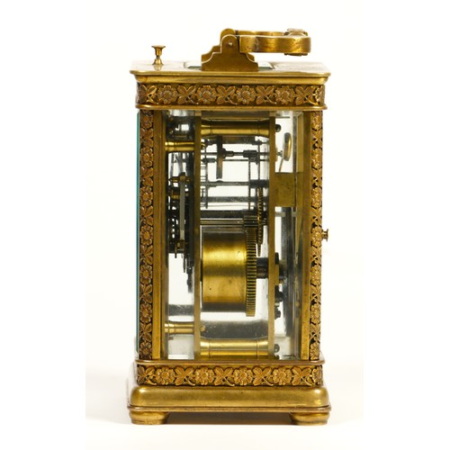 265 - A brass repeating and striking carriage clock, the dial with Arabic numerals, the case with applied ... 