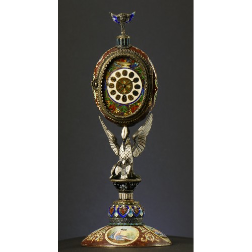 267 - A 19th century Viennese enamel table clock, the oval case containing a pocket watch movement, the ca... 