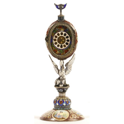 267 - A 19th century Viennese enamel table clock, the oval case containing a pocket watch movement, the ca... 