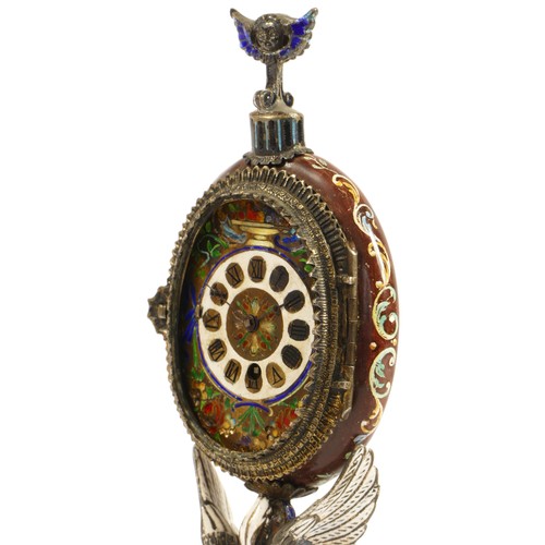 267 - A 19th century Viennese enamel table clock, the oval case containing a pocket watch movement, the ca... 