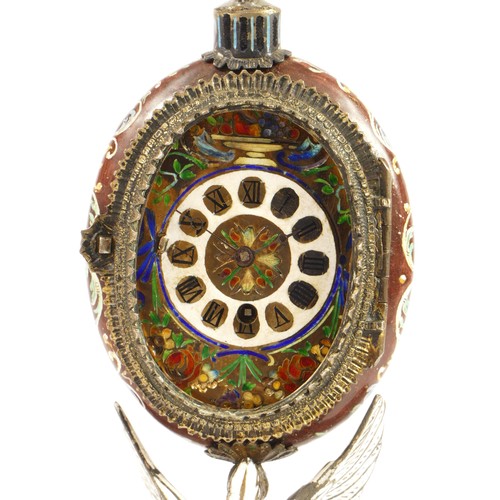 267 - A 19th century Viennese enamel table clock, the oval case containing a pocket watch movement, the ca... 