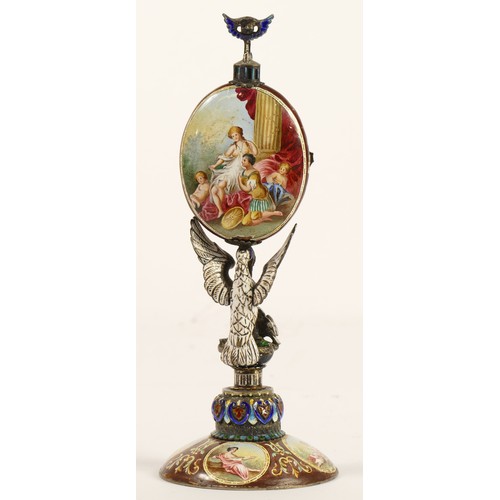 267 - A 19th century Viennese enamel table clock, the oval case containing a pocket watch movement, the ca... 