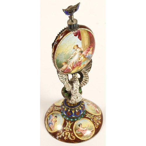 267 - A 19th century Viennese enamel table clock, the oval case containing a pocket watch movement, the ca... 