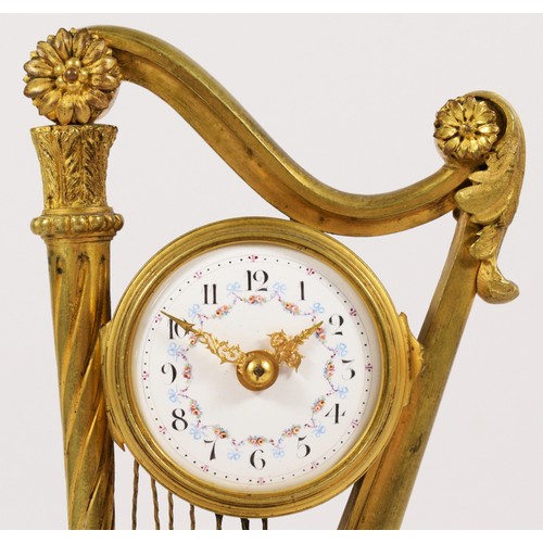 282 - A 19th century French gilt brass mantel clock, the white enamel dial with a floral garland, with a w... 