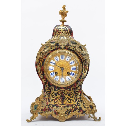 289 - A 19th century French boulle mantel clock, the gilt dial with white enamel numerals, the shaped case... 