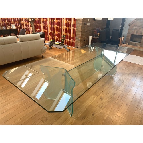 330 - A stylish contemporary Italian designed dining table, comprising edged rectangular plate glass top o... 