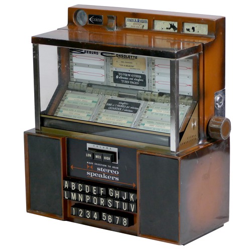 412 - A Seeburg Consolette wall mounted jukebox, model SCH 3-4, with stereo speakers, three volume keys an... 