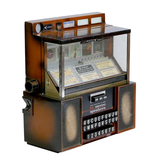 413 - A Seeburg Consolette wall mounted jukebox, model SCH 3-4, with stereo speakers, three volume keys an... 