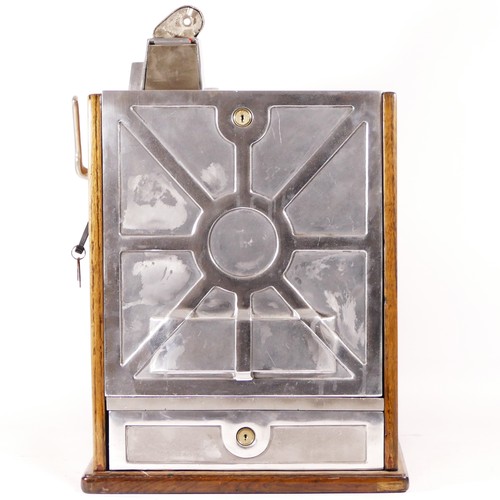 An O.D. Jennings Silent Peacock slot machine, one arm bandit, c