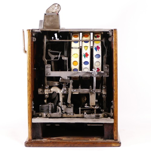 An O.D. Jennings Silent Peacock slot machine, one arm bandit, c