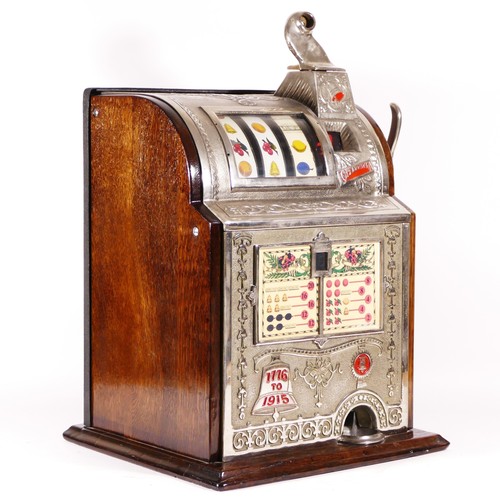 421 - A Mills Operators Bell Spearmint slot machine, one arm bandit, c.1915, restored and working on an Am... 