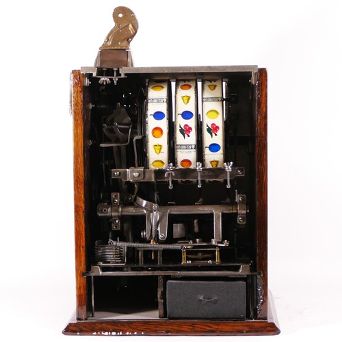 421 - A Mills Operators Bell Spearmint slot machine, one arm bandit, c.1915, restored and working on an Am... 