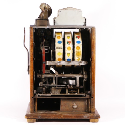 423 - A Mills Poinsettia Revamp slot machine, one arm bandit, c.1932, vertical stack jackpot, restored and... 