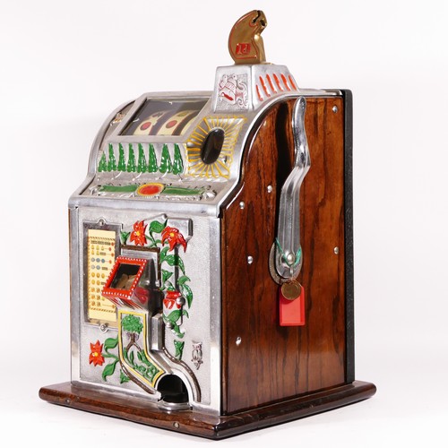 425 - A Mills Poinsettia slot machine, one arm bandit, c.1929, restored and working on a 1D coin, wooden c... 