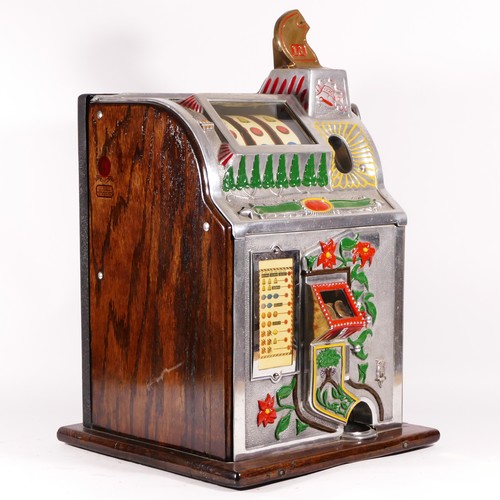 425 - A Mills Poinsettia slot machine, one arm bandit, c.1929, restored and working on a 1D coin, wooden c... 