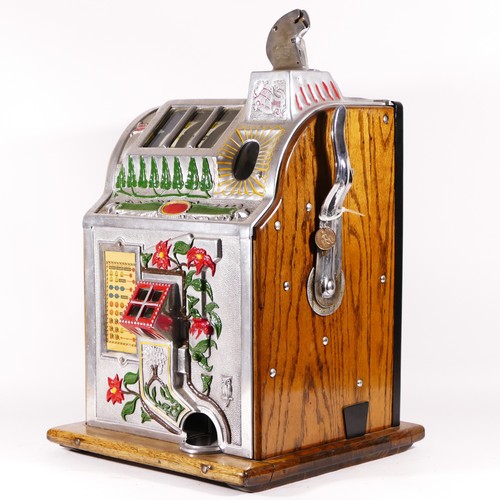 426 - A Mills Poinsettia slot machine, one arm bandit, c.1929, restored and working on a 1D coin, wooden c... 