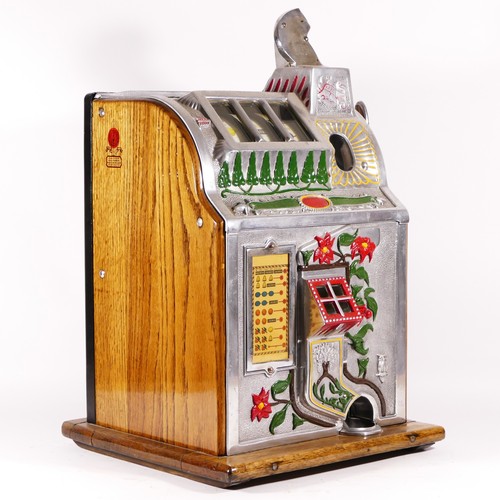 426 - A Mills Poinsettia slot machine, one arm bandit, c.1929, restored and working on a 1D coin, wooden c... 