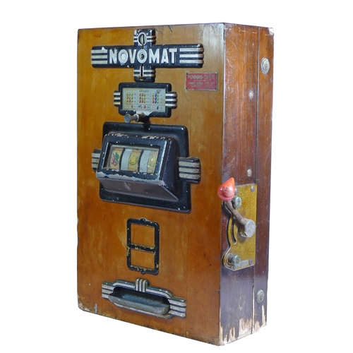 453 - A Novomat slot machine, one arm bandit, c.1950's, works on a old 2p coin, wooden case with cast plas... 