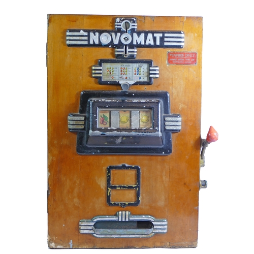 453 - A Novomat slot machine, one arm bandit, c.1950's, works on a old 2p coin, wooden case with cast plas... 