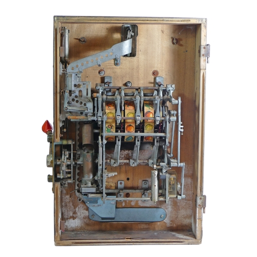 453 - A Novomat slot machine, one arm bandit, c.1950's, works on a old 2p coin, wooden case with cast plas... 