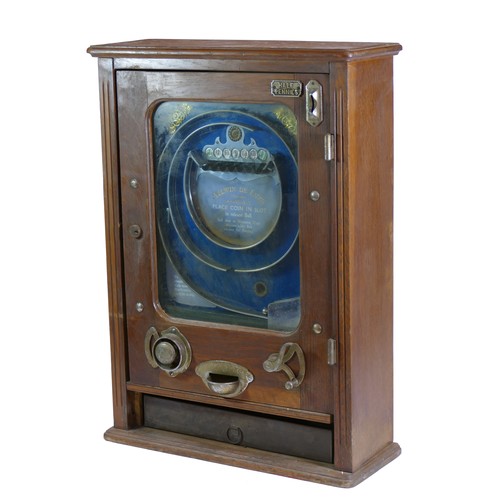 456 - An Allwin De Luxe penny slot machine, c.1920's, oak cabinet, with internal metal ball track, pierced... 