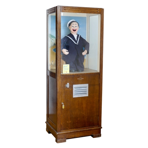 462 - A coin operated arcade automaton, Laugh with Jolly Jack, wooden case with three glazed sides, above ... 