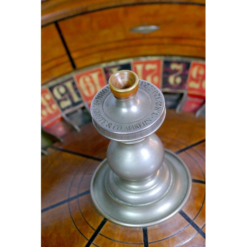 463 - F.Grote & Co, New York roulette wheel, mahogany base with inlaid ebony and cast metal baton decorati... 