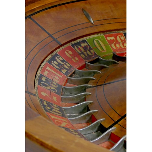 463 - F.Grote & Co, New York roulette wheel, mahogany base with inlaid ebony and cast metal baton decorati... 