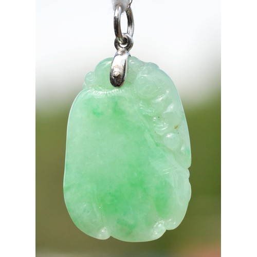 240 - A 14K white gold mounted carved jadeite fruit pendant, 30 x 20mm, 14K white gold chain.