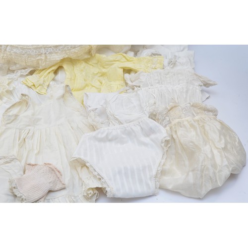 205A - A selection of babies christening clothing to include eight christening gowns of different styles an... 