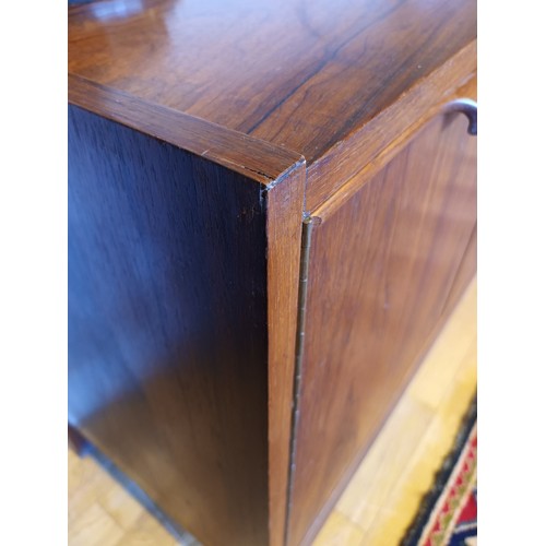 354 - A Danish rosewood sideboard, c.1960s, of long low form with plain top over two banks of three gradua... 