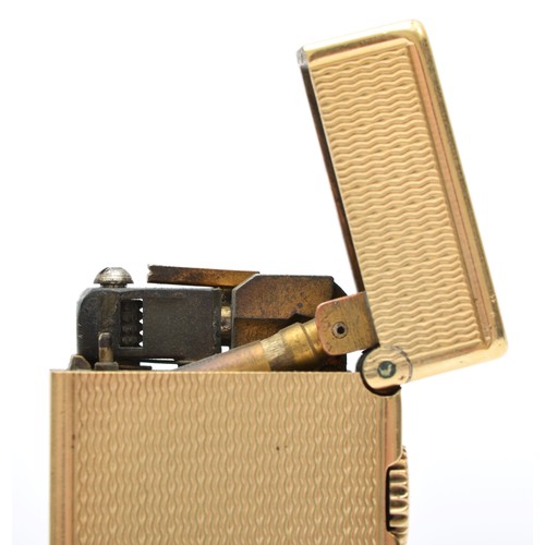 127 - Dunhill, a 9ct gold rollagas cigarette lighter, London 1967, with engine turned decoration, 105gm, o... 