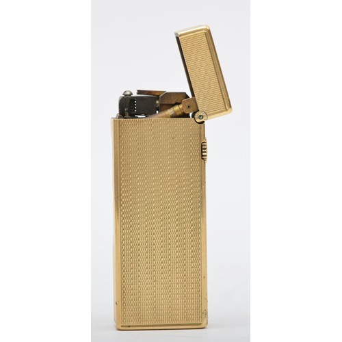 127 - Dunhill, a 9ct gold rollagas cigarette lighter, London 1967, with engine turned decoration, 105gm, o... 