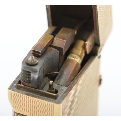 127 - Dunhill, a 9ct gold rollagas cigarette lighter, London 1967, with engine turned decoration, 105gm, o... 