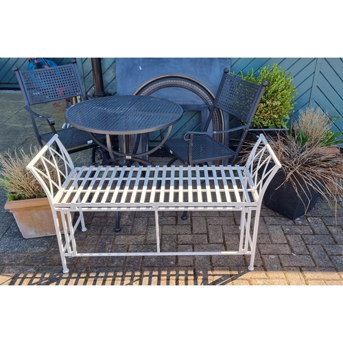 23 - A metal garden table & two chairs, a metal bench, and flower pots