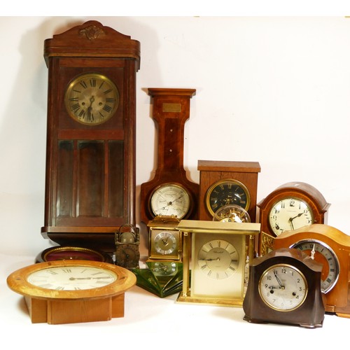 A collection of quartz and mechanical clocks, to include wall clocks