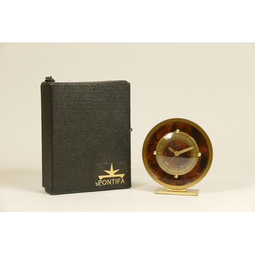 A 1950s Pontifa desk alarm clock, having a Swiss 8 day movement, boxed ...