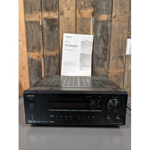 33 - A Onkyo AV receiver, TX-DS595, with manual and a selection of speaker cables