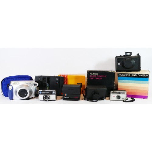 42 - WITHDRAWN FROM SALE. A collection of instant film cameras to include a Fuji Instax 200, a Polaroid E... 