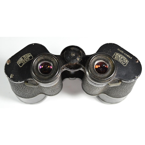 50 - A pair of Carl Zeiss Jenoptem 10x50 binoculars, stamped 4869089, in a leather case