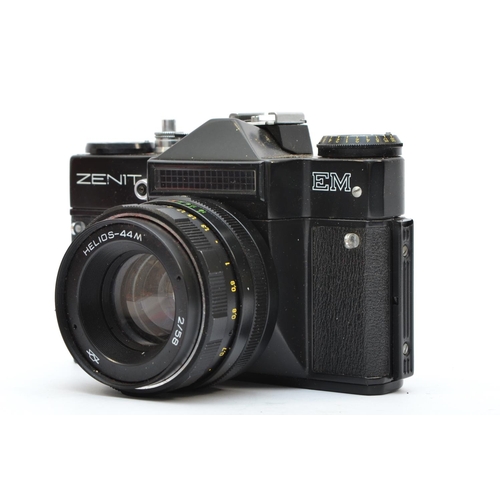 118 - A Zenit EM 35mm film camera, with a Hellios 58mm f2 lens, in original box with case and user manual,... 