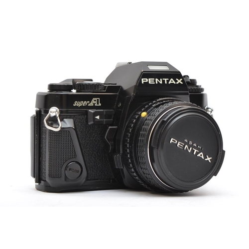 123 - A Pentax Super A 35mm film camera, with a Pentax 50mm f1.7 lens, working, faint hazing in the lens