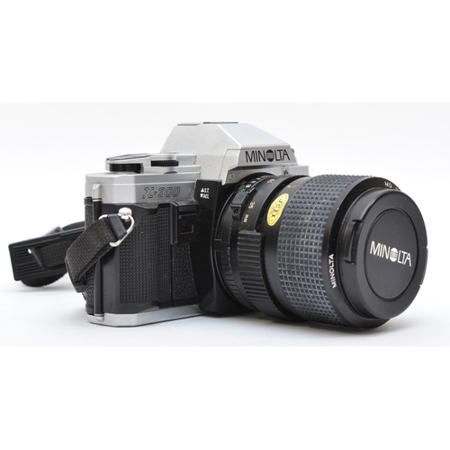 137 - A Minolta X-300 35mm film camera, with a 35mm-75mm f3.5 lens, in original box with lens hood, workin... 