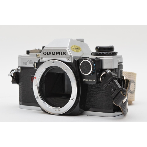 142 - A Olympus OM10 35mm film camera, body only, working