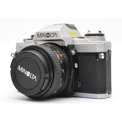 145 - A Minolta X-500 35mm film camera, with a Minolta 50mm f2 lens, case, working, lens requires a strip ... 