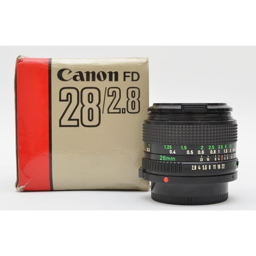 203 - A Canon FD 28mm f2.8 lens, in original box, working